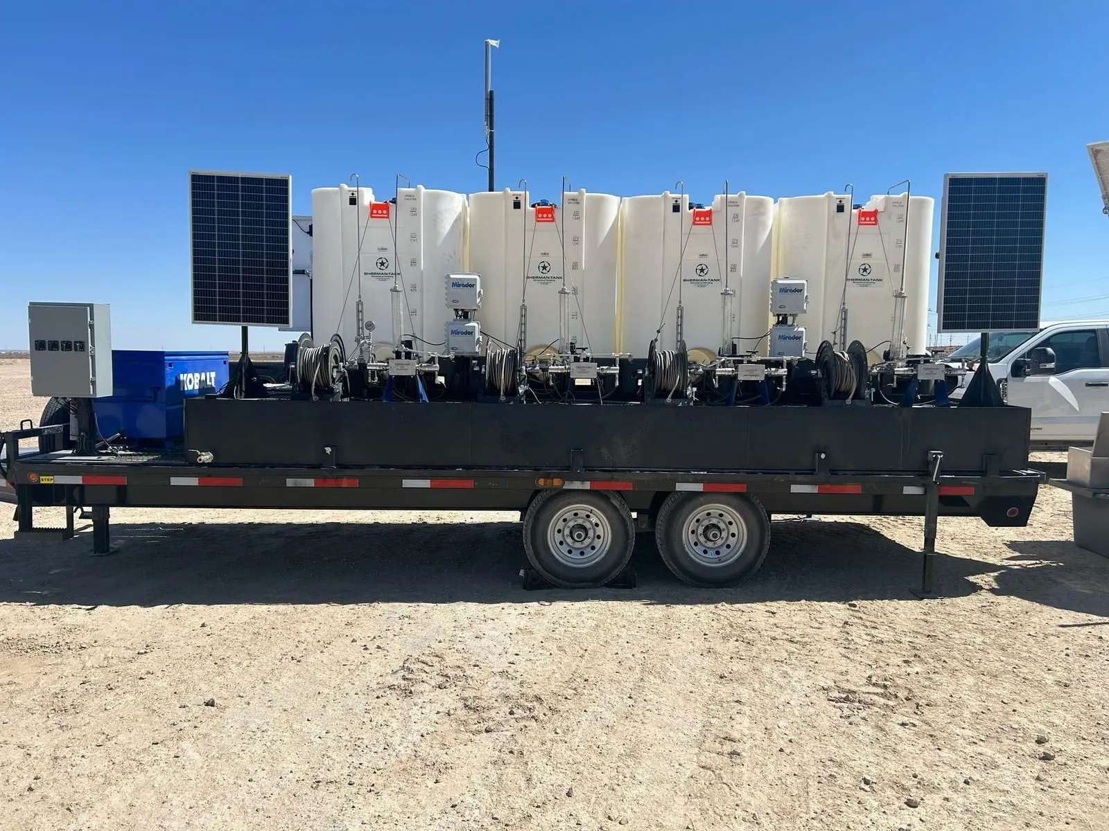 DC3 flowback trailer with Sherman tanks, solar panels, and Mirador pumps