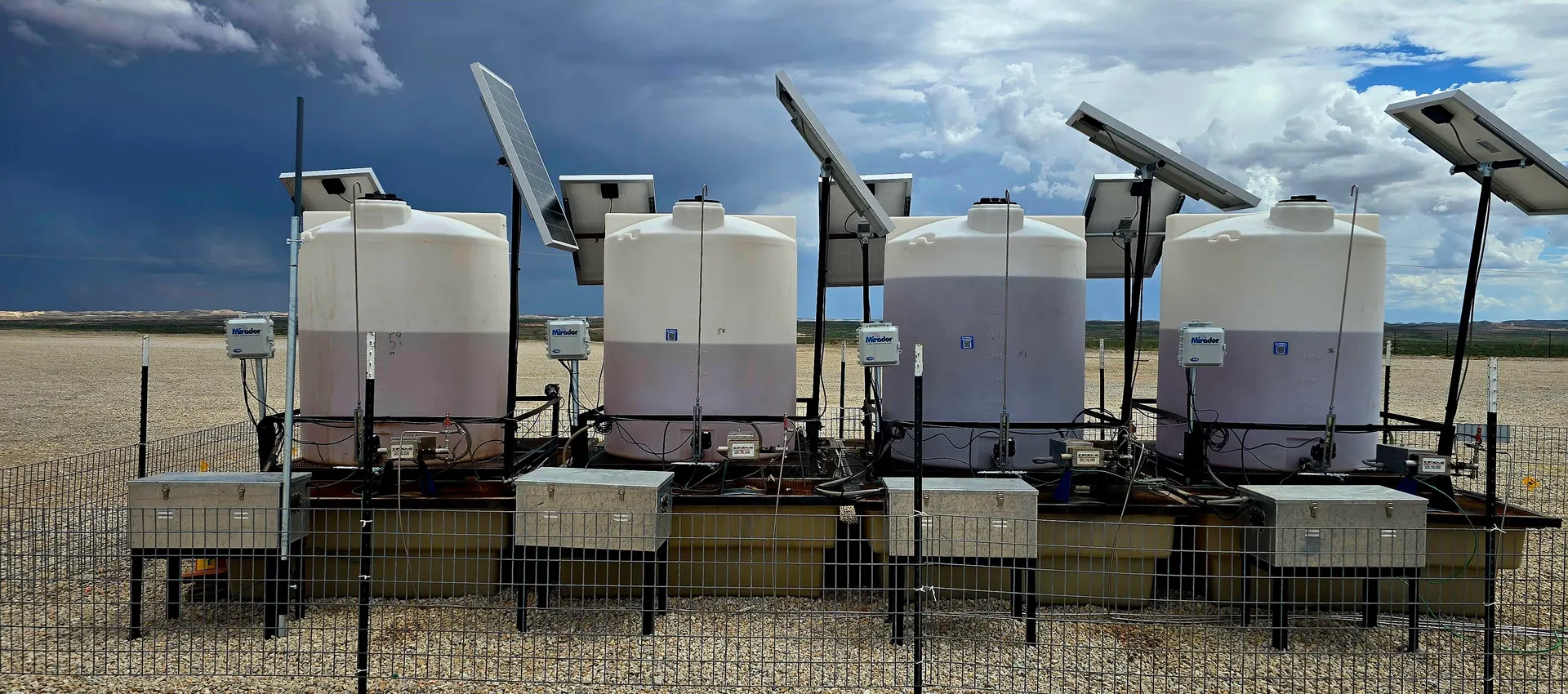 Mirador controllers with solar panels on chemical tank row